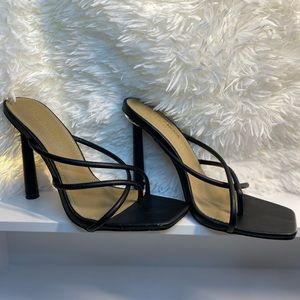 Black heels with silver accents on the back size 9